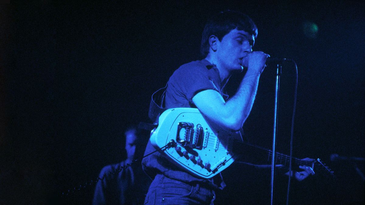 FEBRUARY 29: LYCEUM Photo of Ian CURTIS and JOY DIVISION, Ian Curtis performing live onstage, playing Vox Phantom Special VI guita