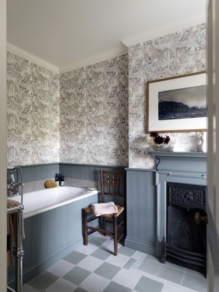 traditional bathroom by K&H Design with blue panelling and wallpaper