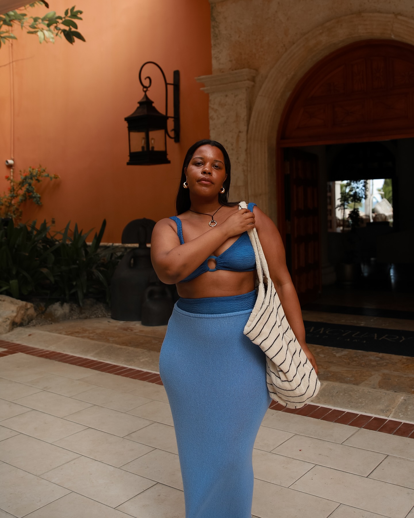 An image of @styleidealist wearing a blue Hunza G and a Monday Swimwear sarong.