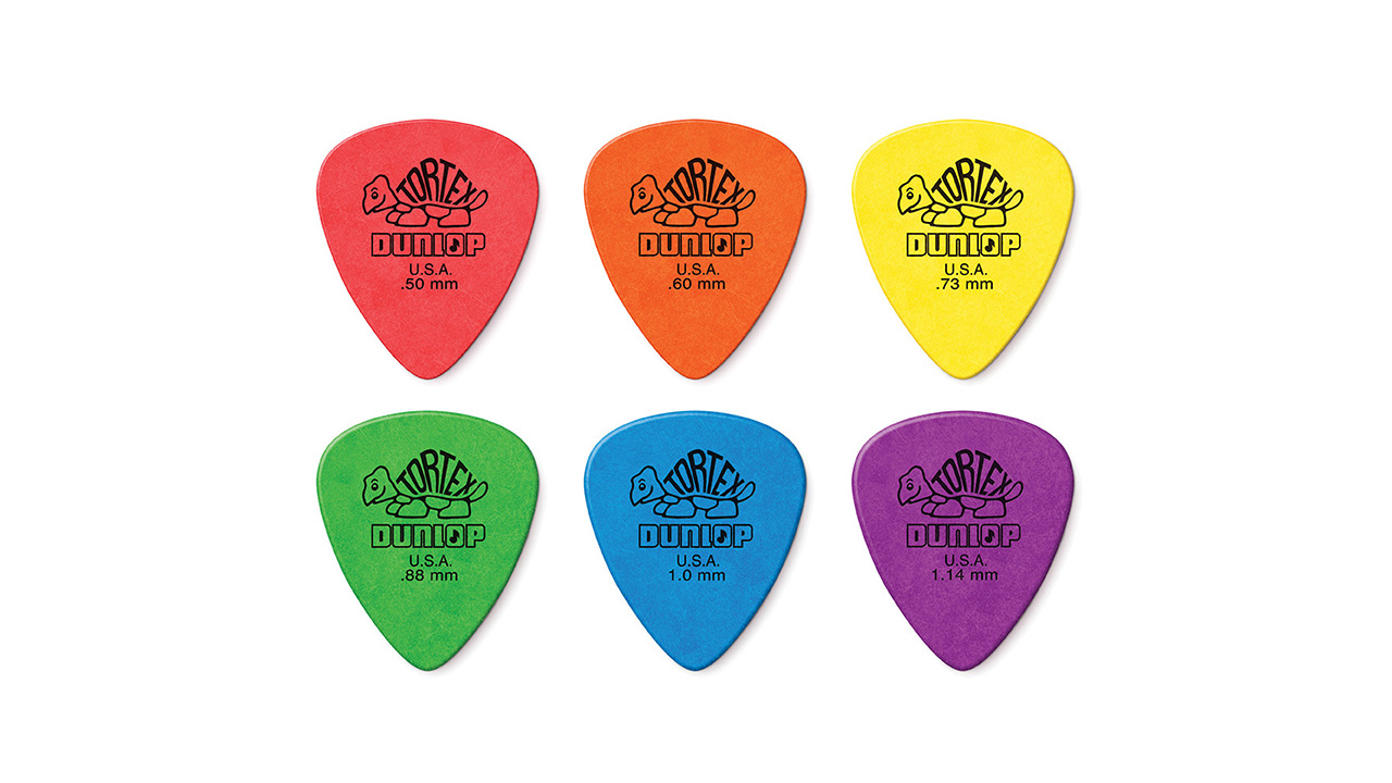 A picture showing six Dunlop Tortex Standard guitar picks in a variety of bright colours