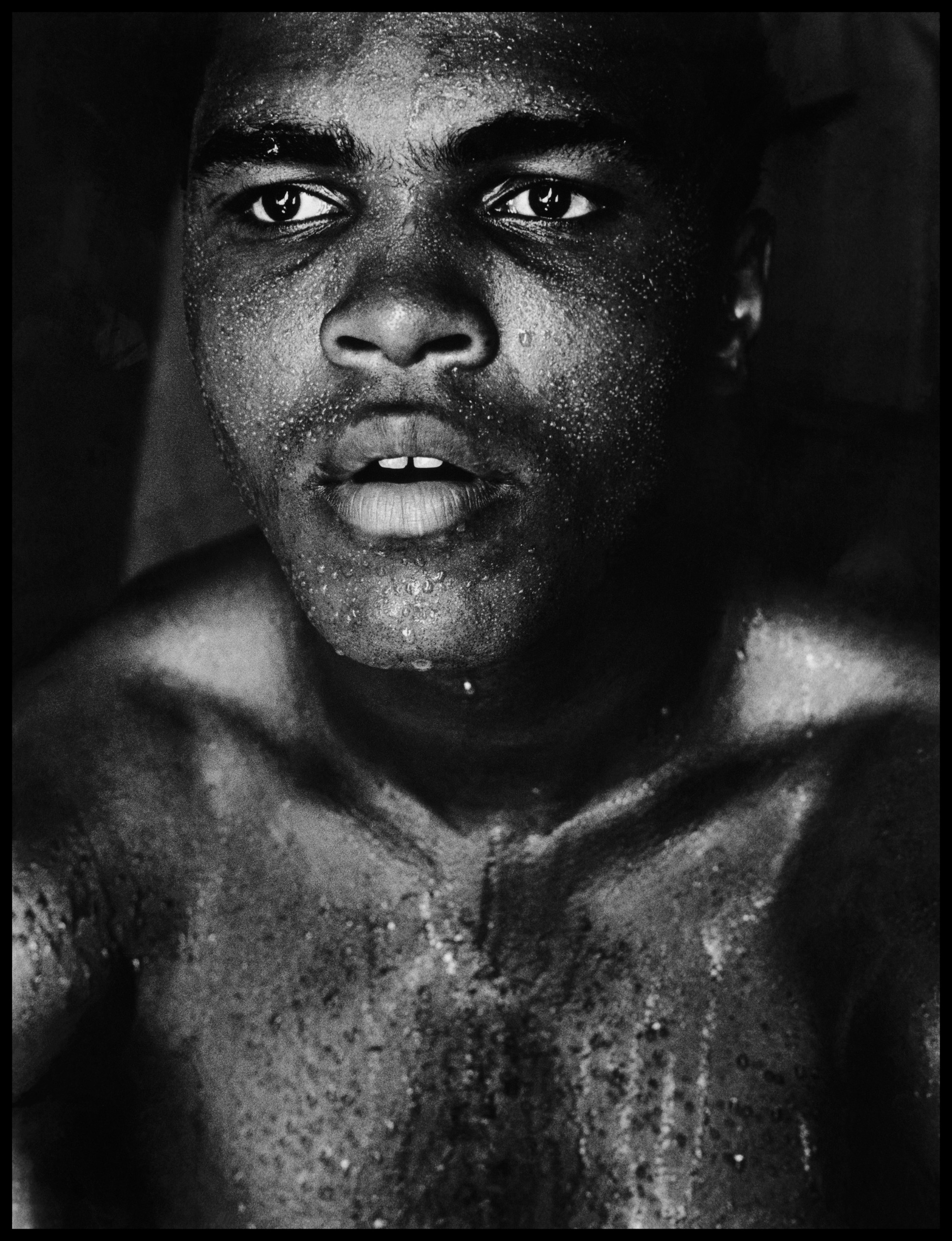 A close-up portrait shows Muhammad Ali's sweat-streaked face and bare shoulders, his expression calm and direct