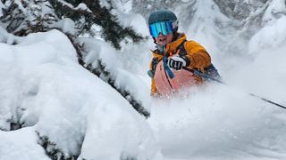 Woman wearing Ortovox Mesola ski jacket for skiing