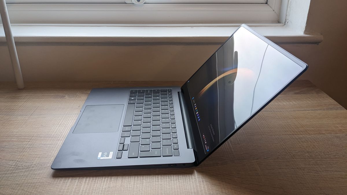 The Samsung Galaxy Book3 Pro 14-inch laptop pictured atop a wooden desk.