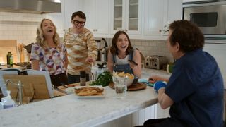 A scene from the film showing Michael, his wife Tracy and two of their adult children laughing together in the family kitchen