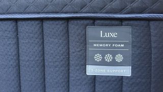 Close detail images of the DreamCloud Luxe Memory Foam mattress, showing design features like the quilted top of the bed and the handles sewn onto the sides