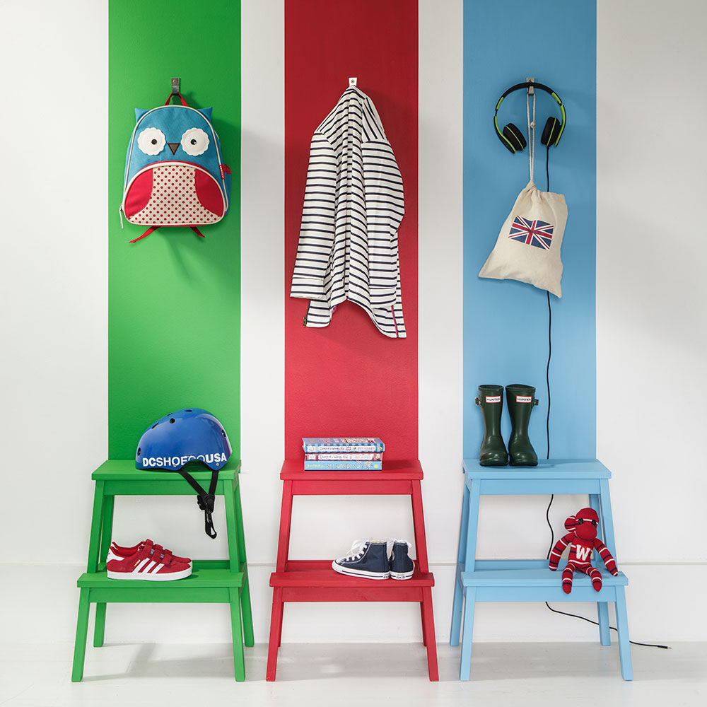 white room with colourful chairs and toys