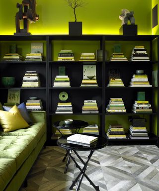 best green paints, acid green living room/study area with green sofa and bookcase
