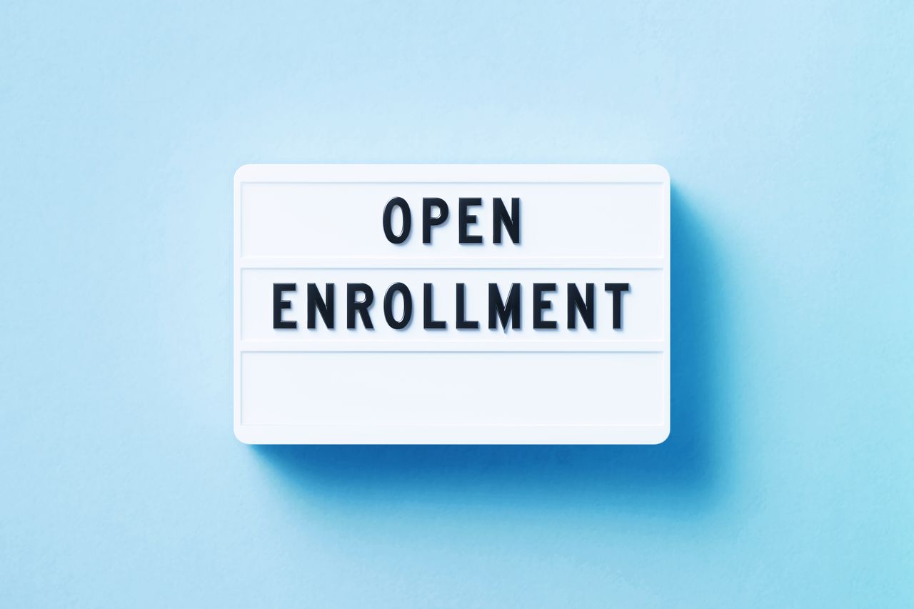 black and white open enrollment sign