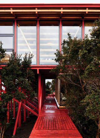Red timber walkway to the cabin