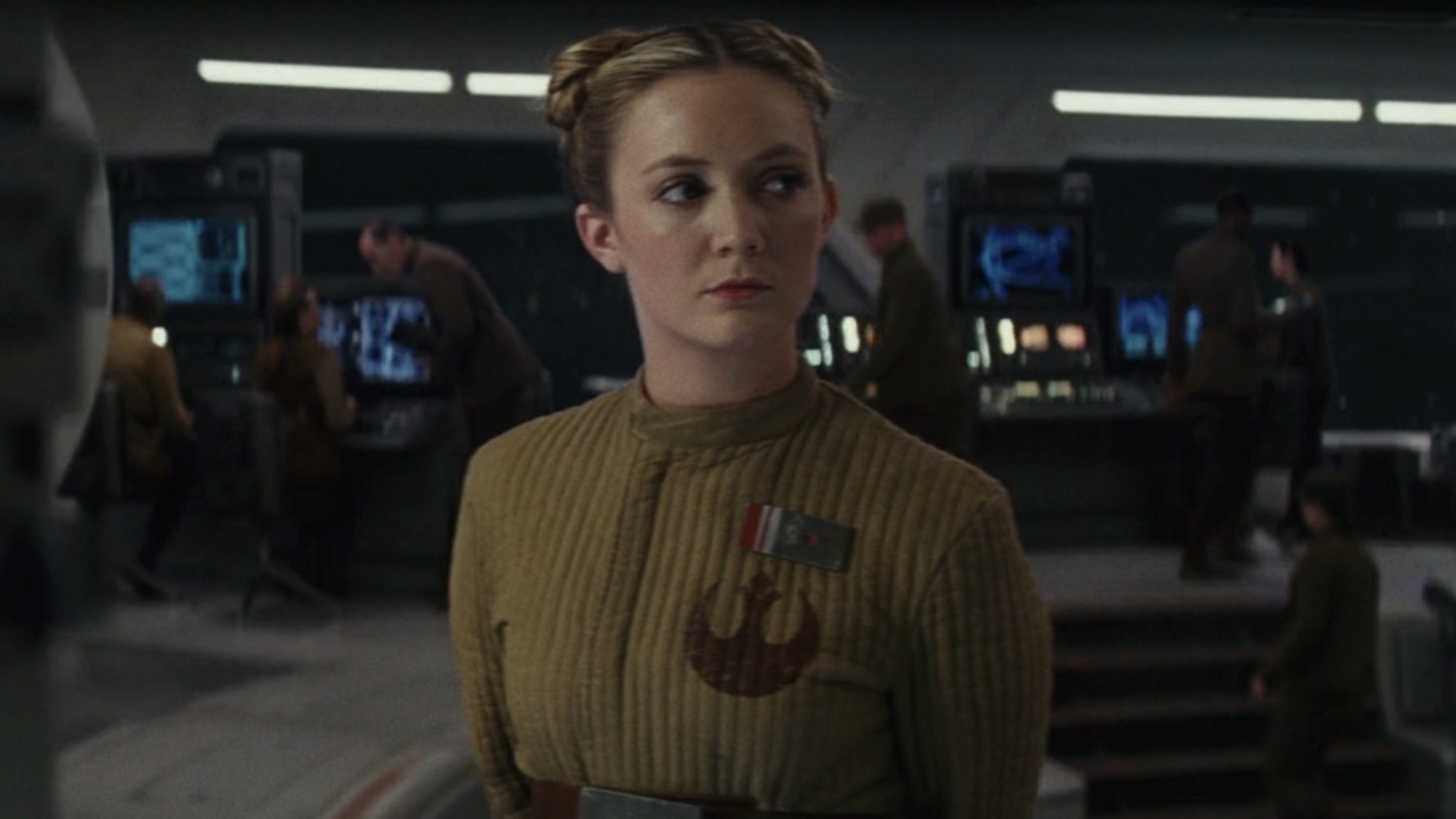 Billie Lourd with hair buns nodding at Poe in The Last Jedi.
