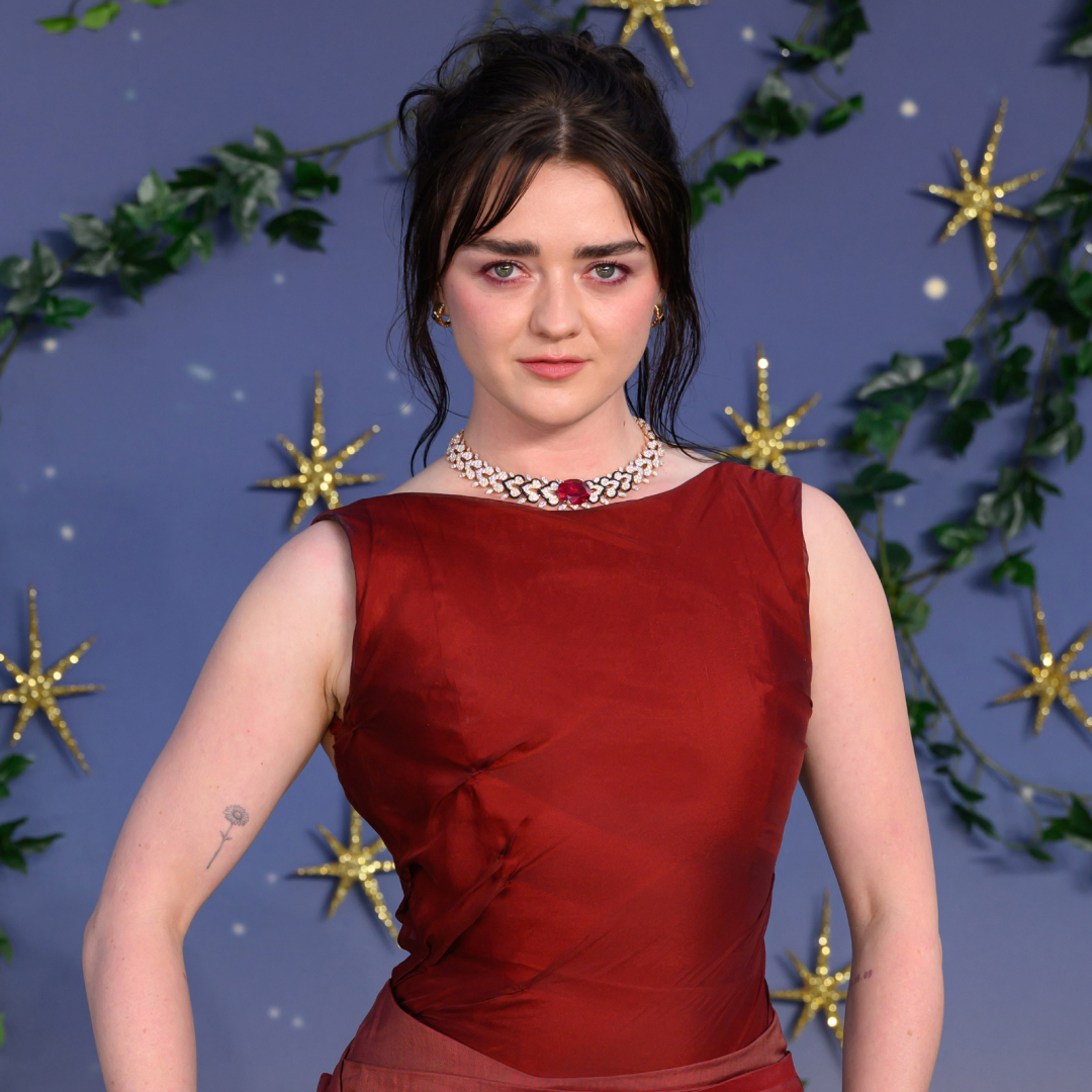Maisie Williams wore a red gown to the Practical Magic 2 premiere in London, which was inspired by Sandra Bullock