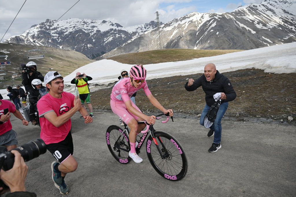 LIVIGNO MOTTOLINO ITALY MAY 19 Tadej Pogacar of Slovenia and UAE Team Emirates Pink Leader Jersey competes in the chase group climbing the Mottolino 2387m while fans cheer during the 107th Giro dItalia 2024 Stage 15 a 222km stage from Manerba del Garda to Livigno Mottolino 2387m UCIWT on May 19 2024 in Livigno Mottolino Italy Photo by Dario BelingheriGetty Images