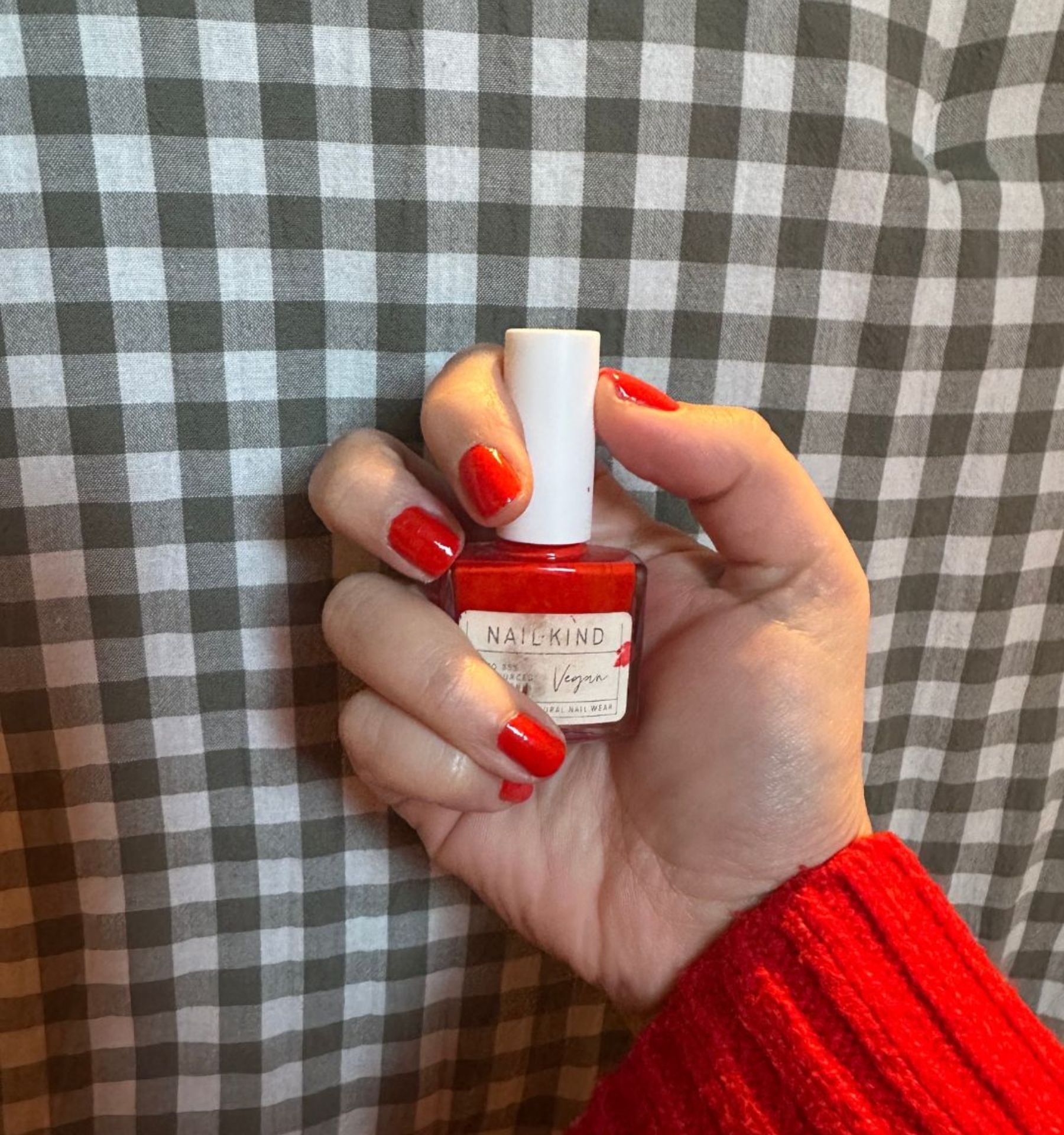 an image of Rhiannon's zesty orange nails using Nail Kind Burning Love