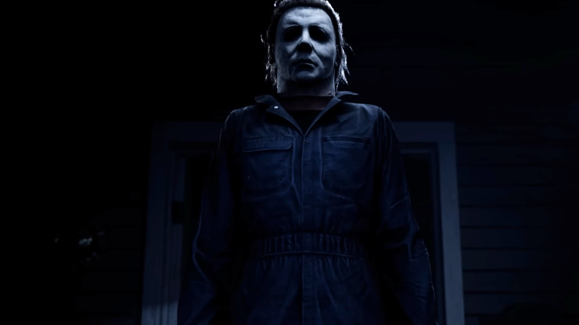 Michael Myers standing in a doorway during the trailer for Halloween: The Game.