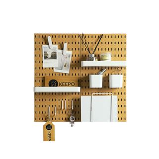 A wooden pegboard with shelving and accessories