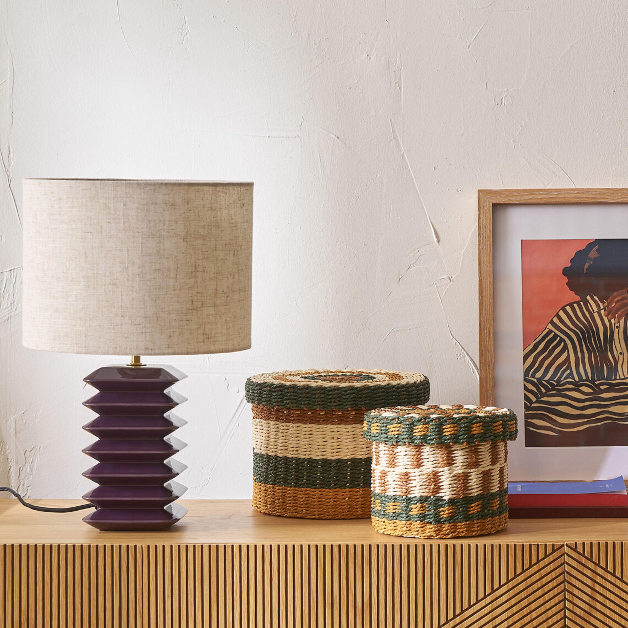 table lamp on a sideboard with storage pots