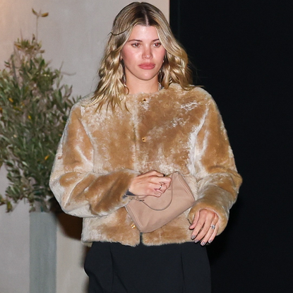 Sofia Richie Grange wore the "wrong shoe" theory with trousers, a fur jacket, and flip-flops for date night