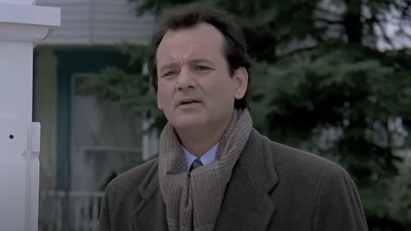 Phil Connors (Bill Murray) talks to a neighbor in Groundhog Day