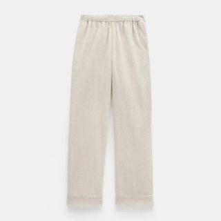 A cutout image of cream Hush Cord Joggers against a pale background