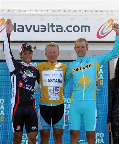 Astana rider Andrey Kashechkin (R) stands on the podium