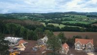 Construction of new detached houses with conversion of stable block to house nearby. Wales