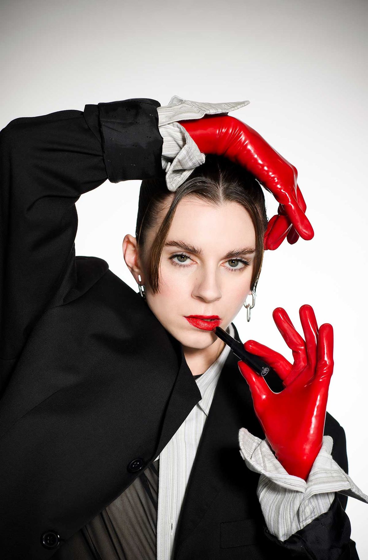Lyndsey Gunnulfsen of the band Pvris poses for a portrait in red gloves