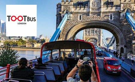 People on the on the TootBus clicking pictures of the Tower Bridge