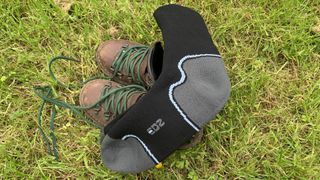 EDZ waterproof socks and hiking boots lying in the grass