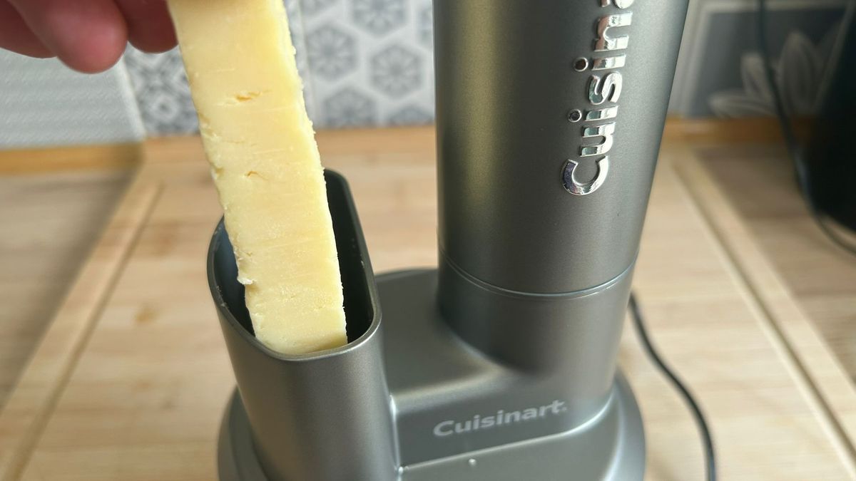 Feeding cheese into chute of Cuisinart Power Blend Immersion Blender