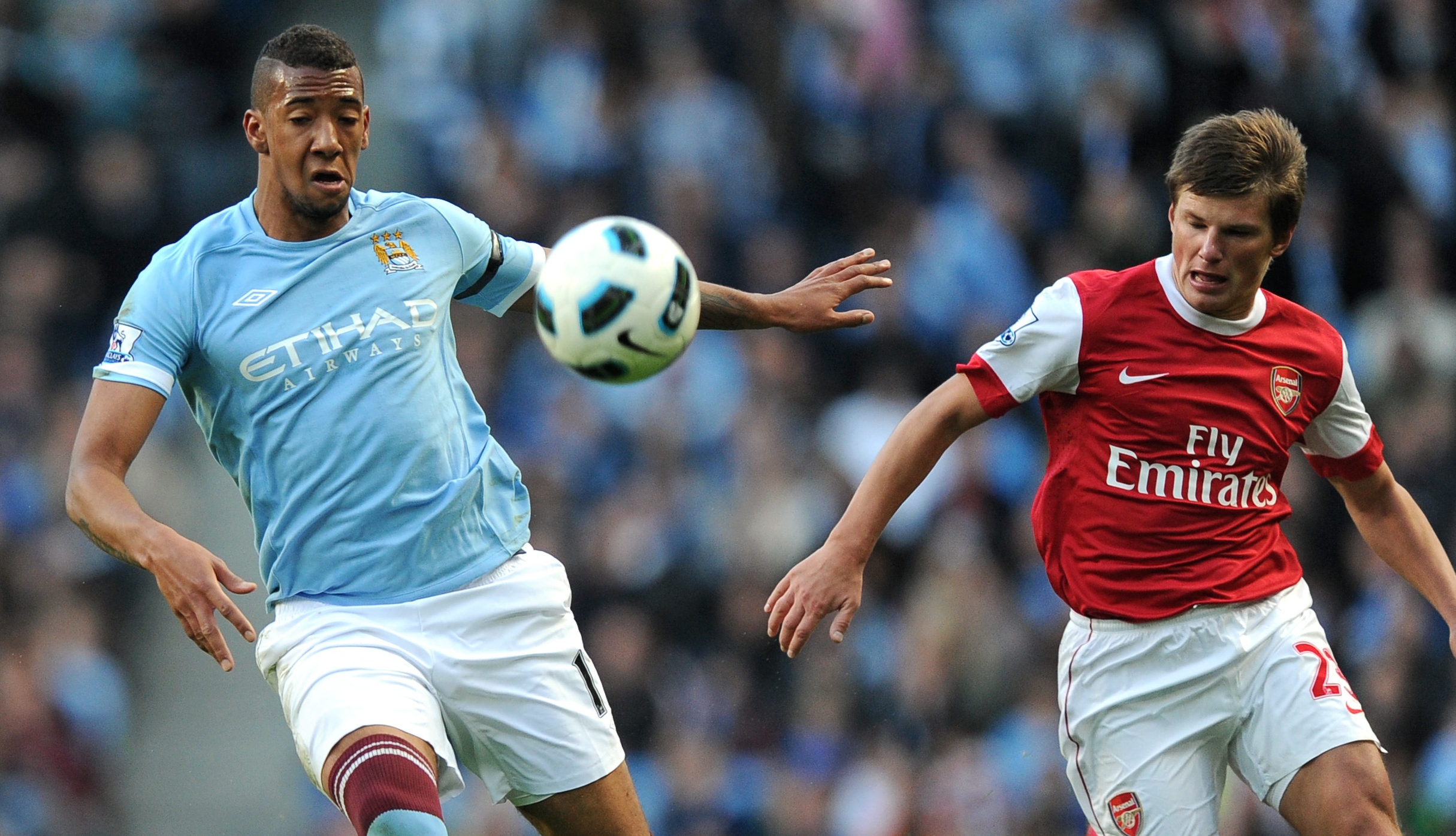 Jerome Boateng of Manchester City and Andrey Arshavin of Arsenal (Photo by AMA/Corbis via Getty Images)