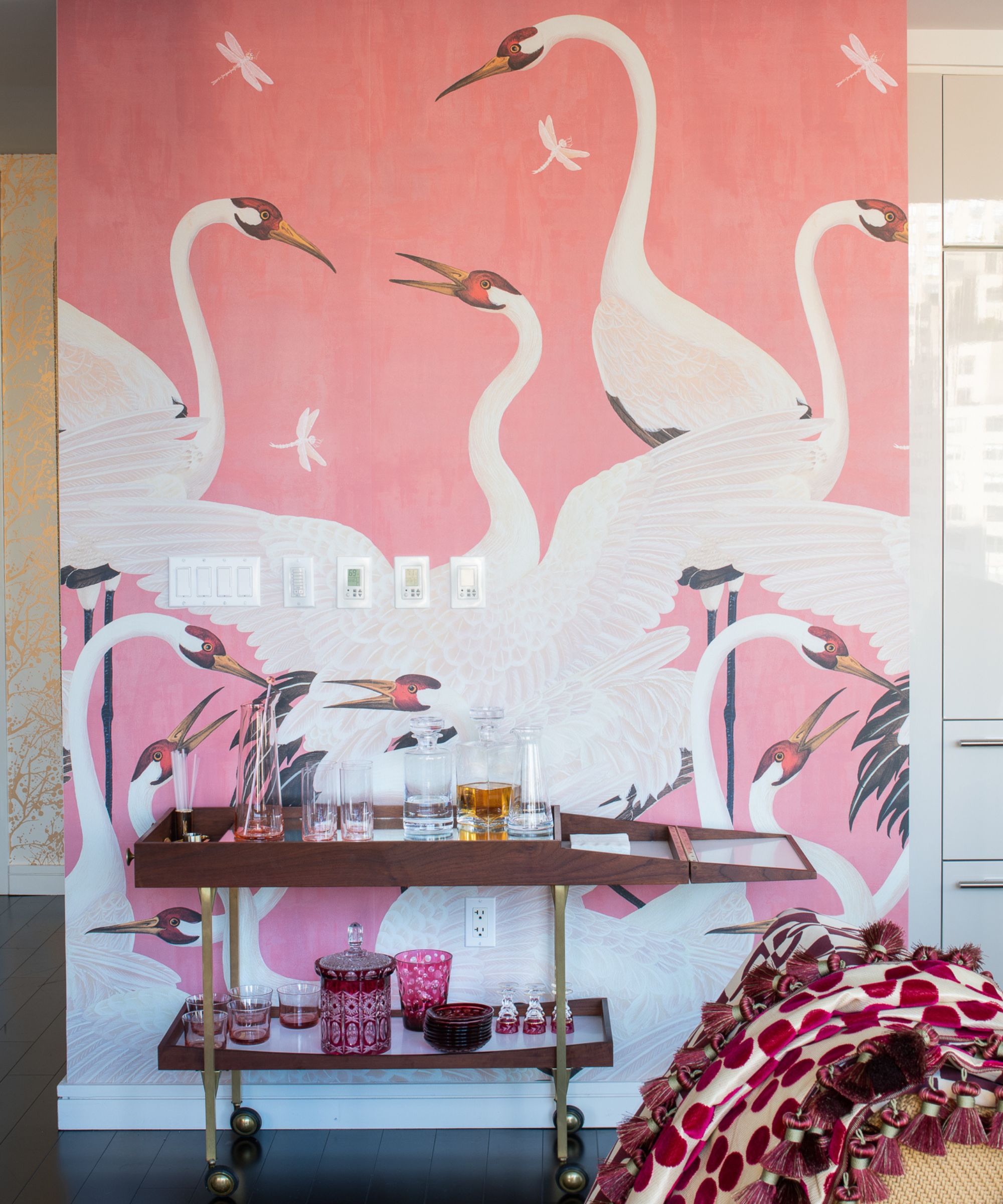 gucci pink bird wallpaper in an entryway