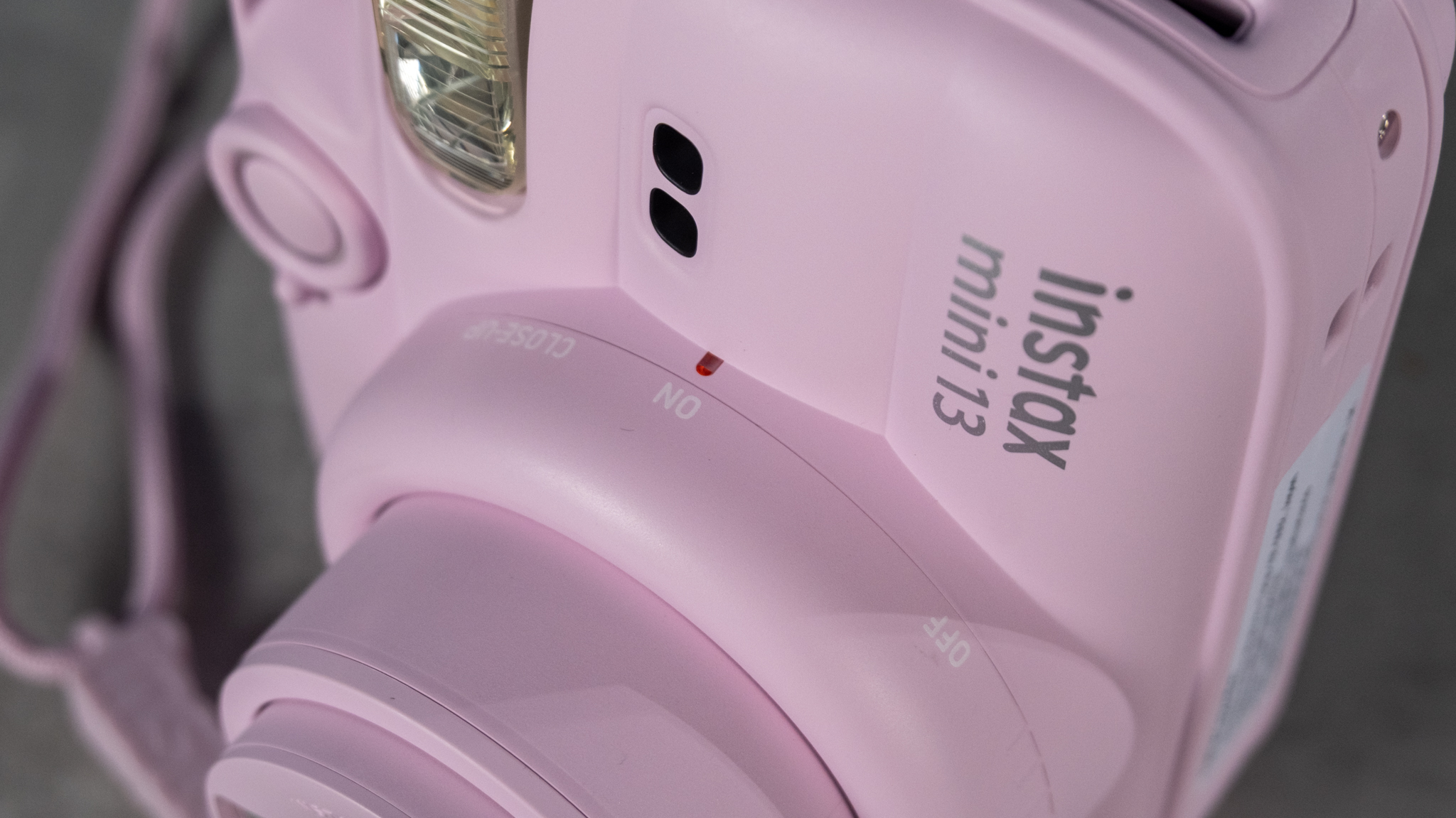 A Candy Pink Fujifilm Instax mini 13 instant camera
