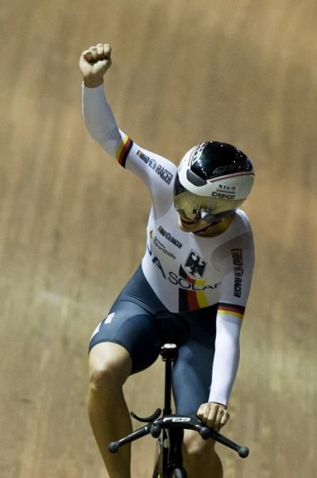 Miriam Welte celebrates winning the rainbow jersey in the women's 500m