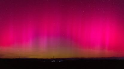 A photo of a bright pinkish-red aurora in China