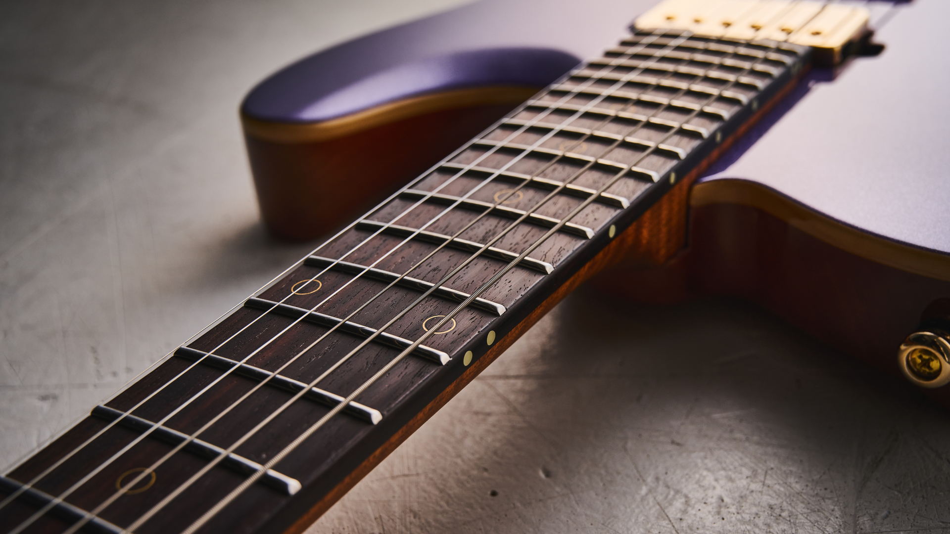 Harley Benton Fusion-T II HH RW HT in Purple Metallic finish with gold hardware. Shot on white surface.