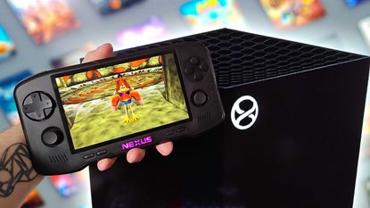 Hand holding Evercade Nexus next to a mockup of the next-gen Xbox Project Helix console with Banjo-Tooie gameplay on screen with Kazooie in trot mode.