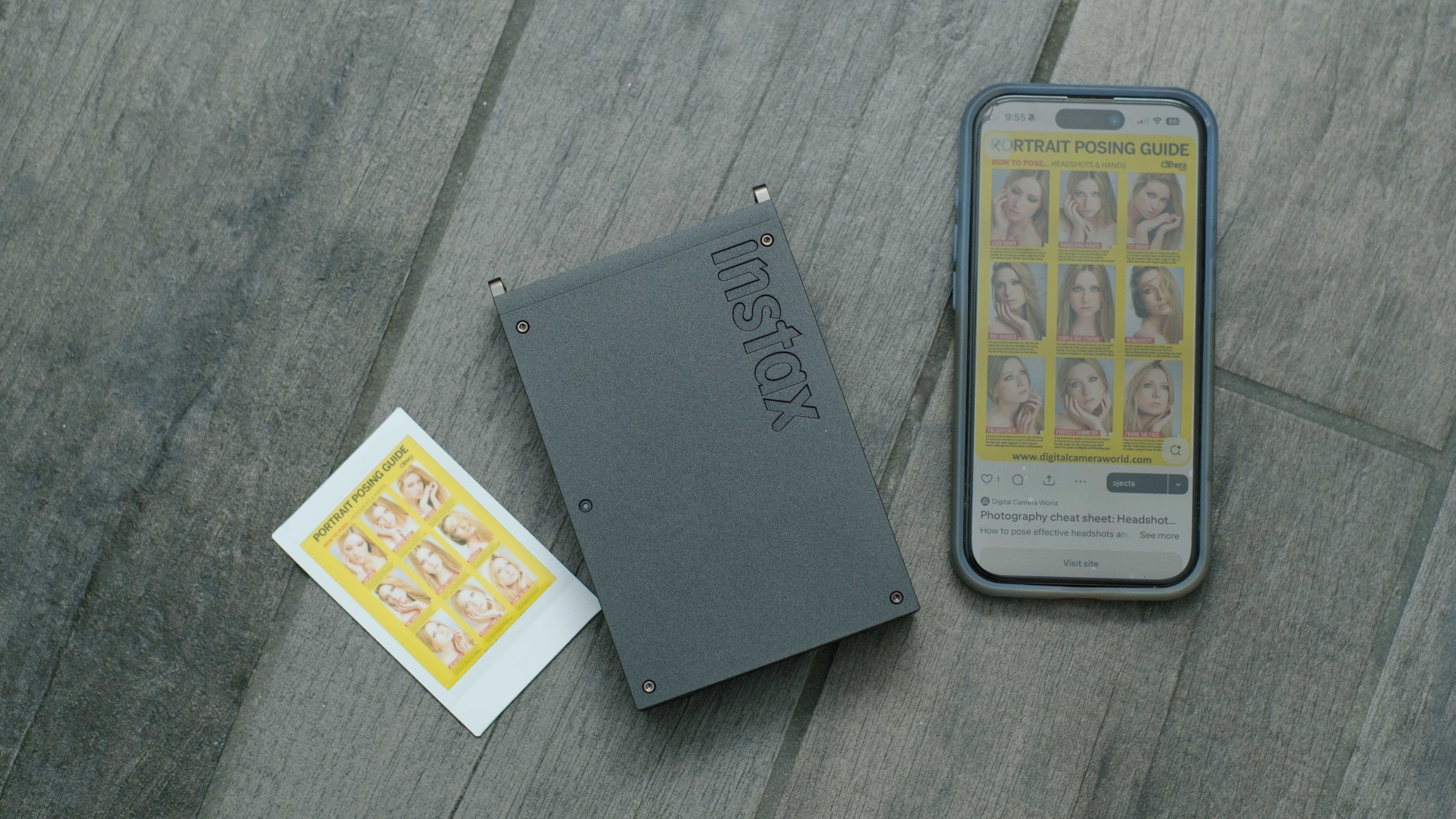 The Fujifilm Instax Mini Link+ on a gray background with instant prints