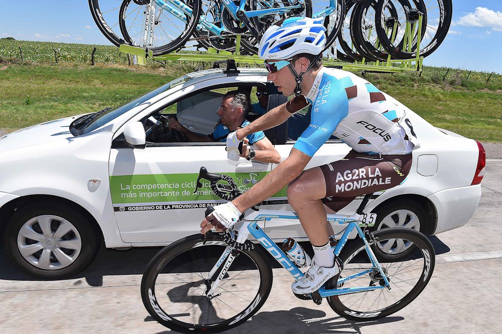 AG2R's Axel Domont grabs a bottle.