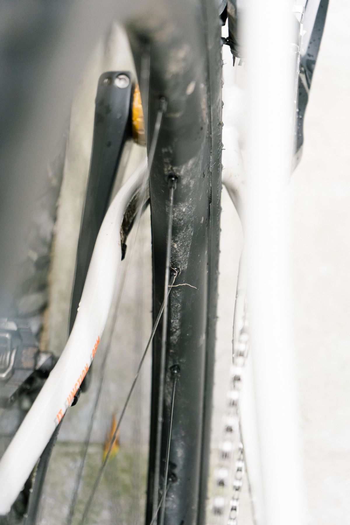 The rear wheel of a gravel bike showing the frame clearance