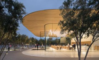 Apple Park Visitor Center, US, by Foster + Partners. A large building with glass walls and a wooden roof.