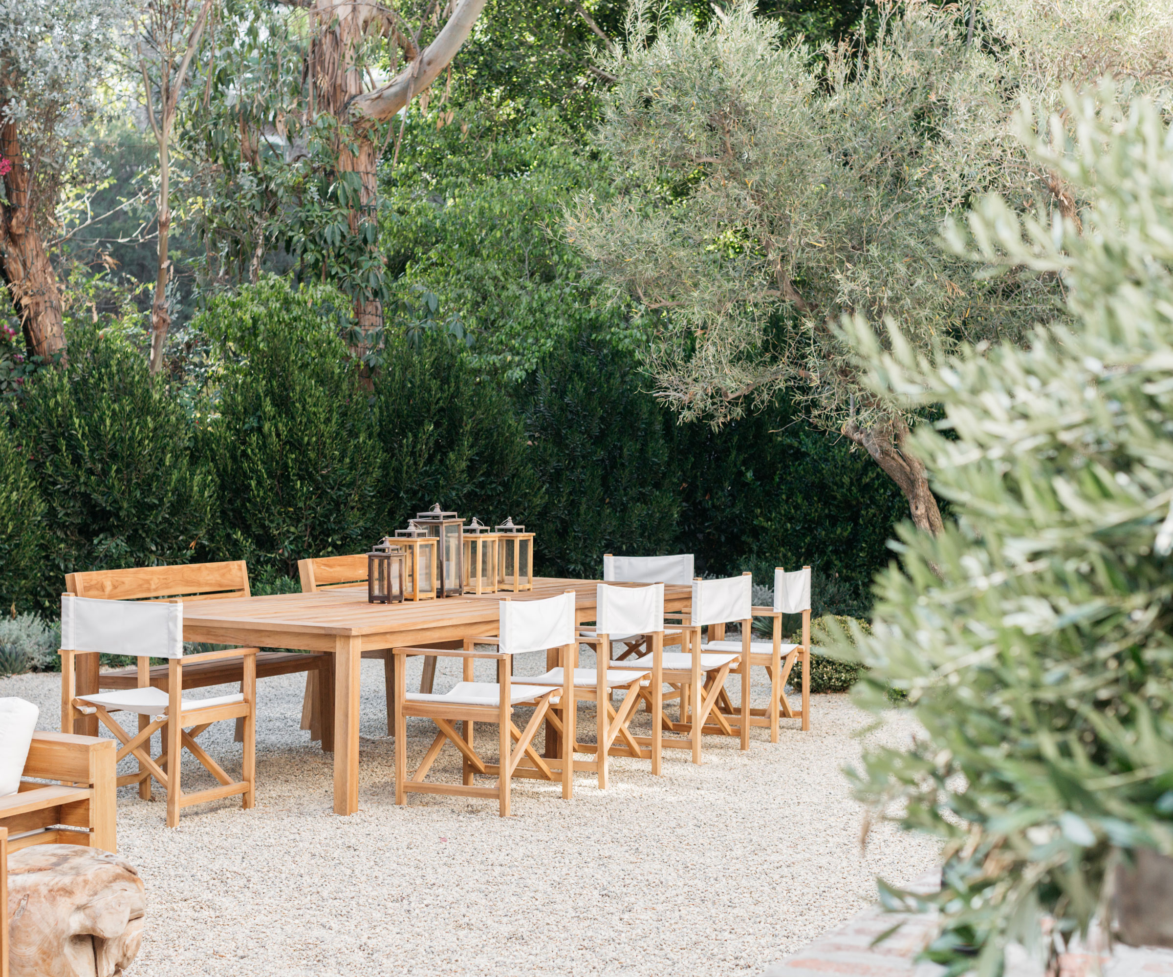 garden design with gravel landscaping, trees and garden furniture set