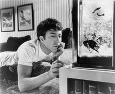Dustin Hoffman In 'The Graduate.' Dustin Hoffman plays with his ashes from his cigarette in a scene from the film 'The Graduate', 1967. (Photo by Embassy Pictures/Getty Images)