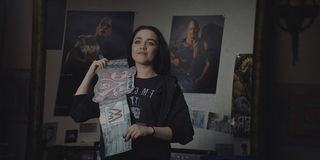 Fighting With My Family Florence Pugh stands with her cardboard championship belt in her bedroom