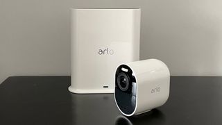 Arlo Ultra 2 home security camera and hub on table