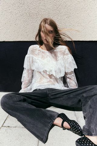 H&M model wears a boho blouse.