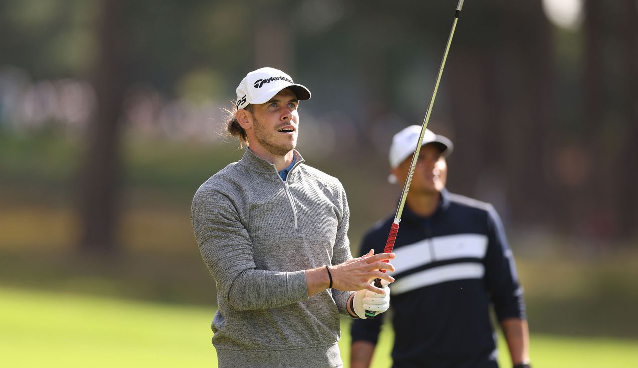 Gareth Bale watches his second shot from the fairway