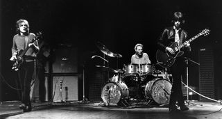 Cream perform during their farewell concert, with Eric Clapton playing a Gibson ES-335.