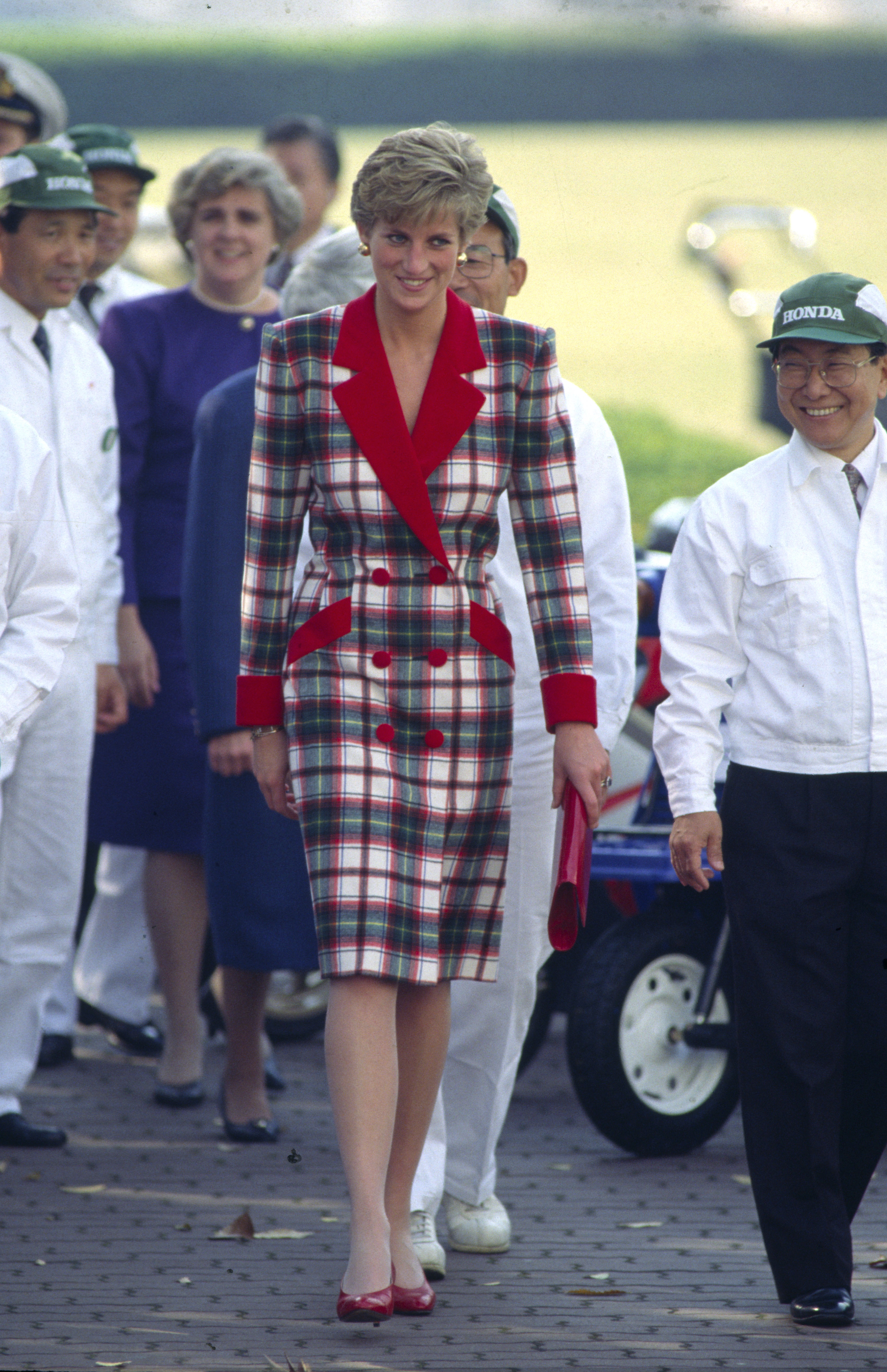 Diana, Princess Of Wales, Visiting The Honda Factory During Her Official Tour Of Japan Wearing A Tartan Coat Dress With Designed By Fashion Designer Catherine Walker