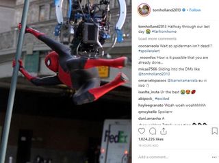 Spider-Man swinging on a bar, in set photo image