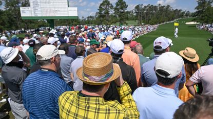 Patrons watch the first round of The Masters 